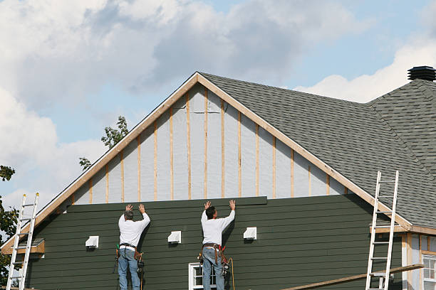 Professional Siding technician working in Central Islip, NY
